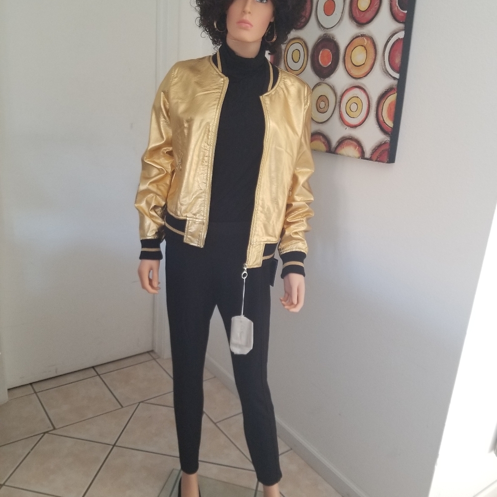 Gold jacket with black pants